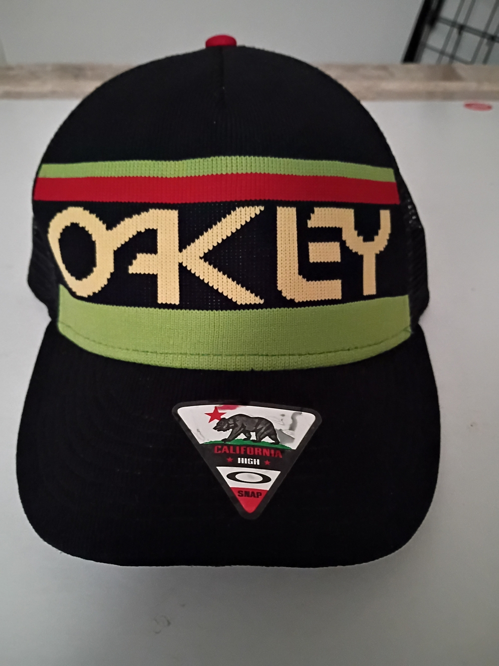 Oakley Men's Black Cap with Lime Green, Red & Cream Logo Snap Back